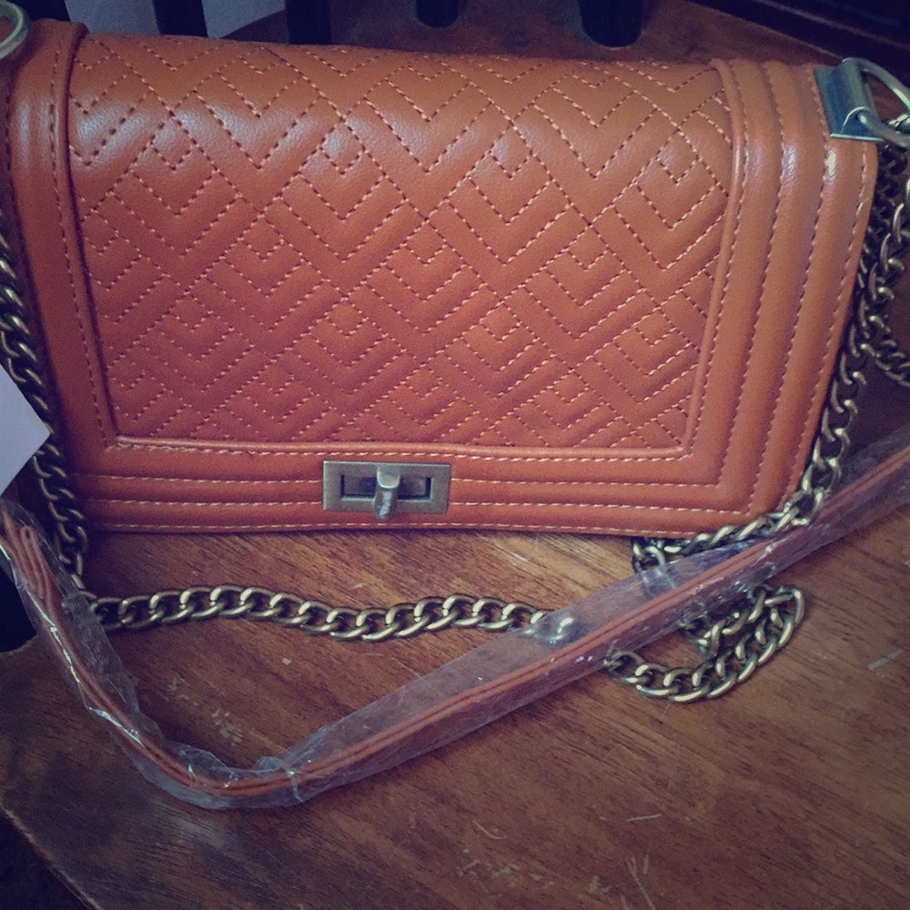 A fashionable tan color purse
